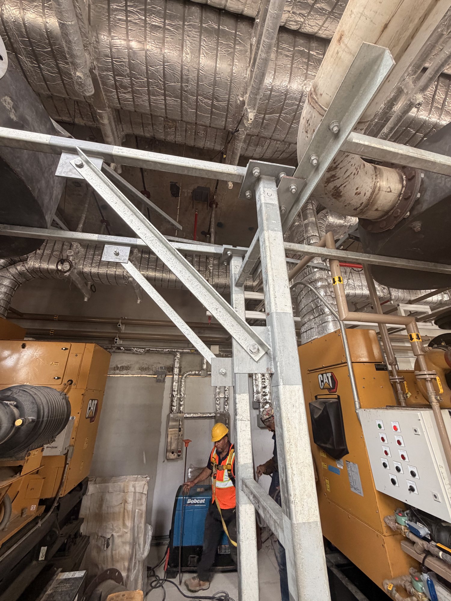 Galvanized support members and bolted connections in the generator room during field work