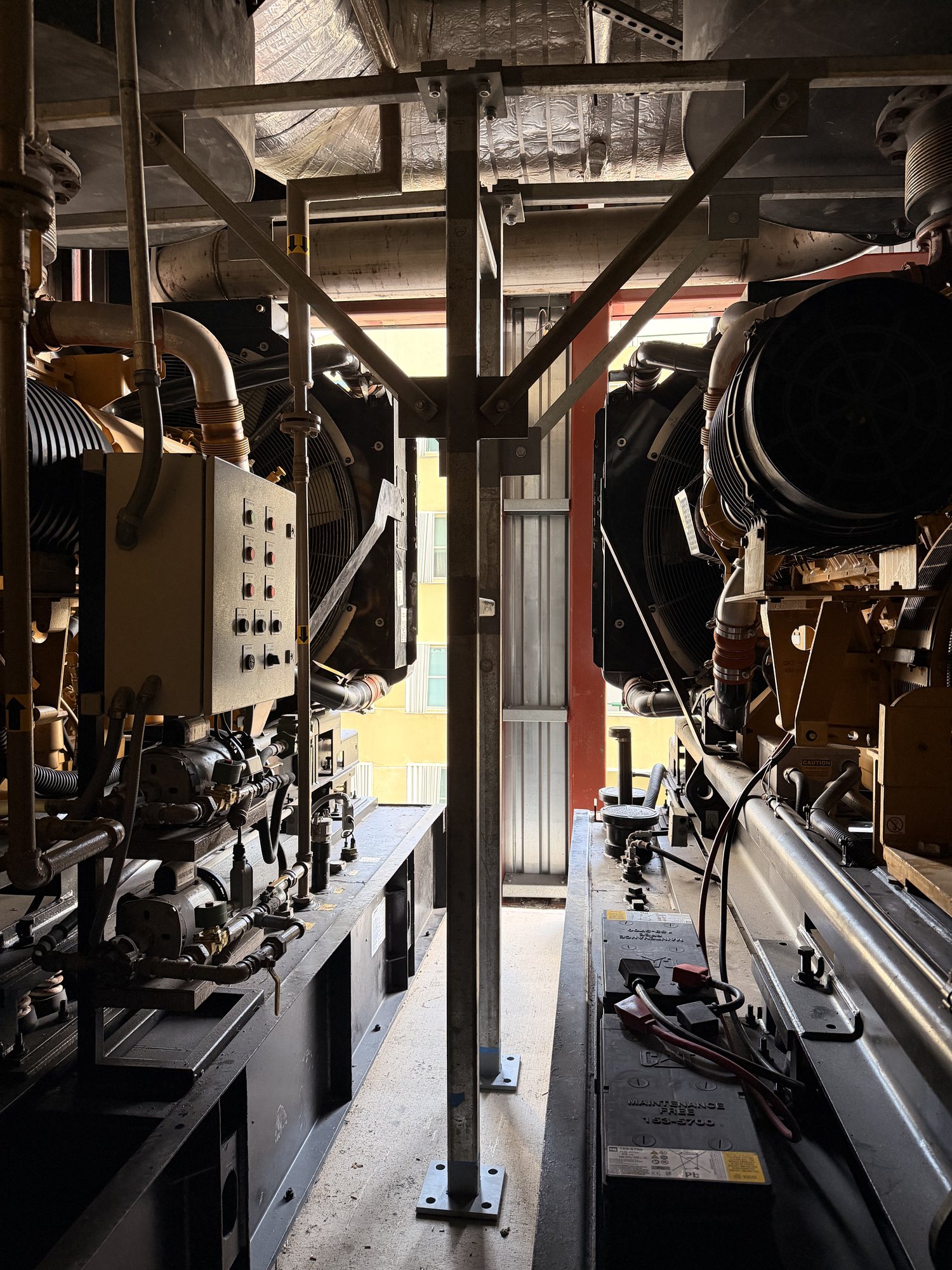 Support frames and bracing positioned between two existing generators